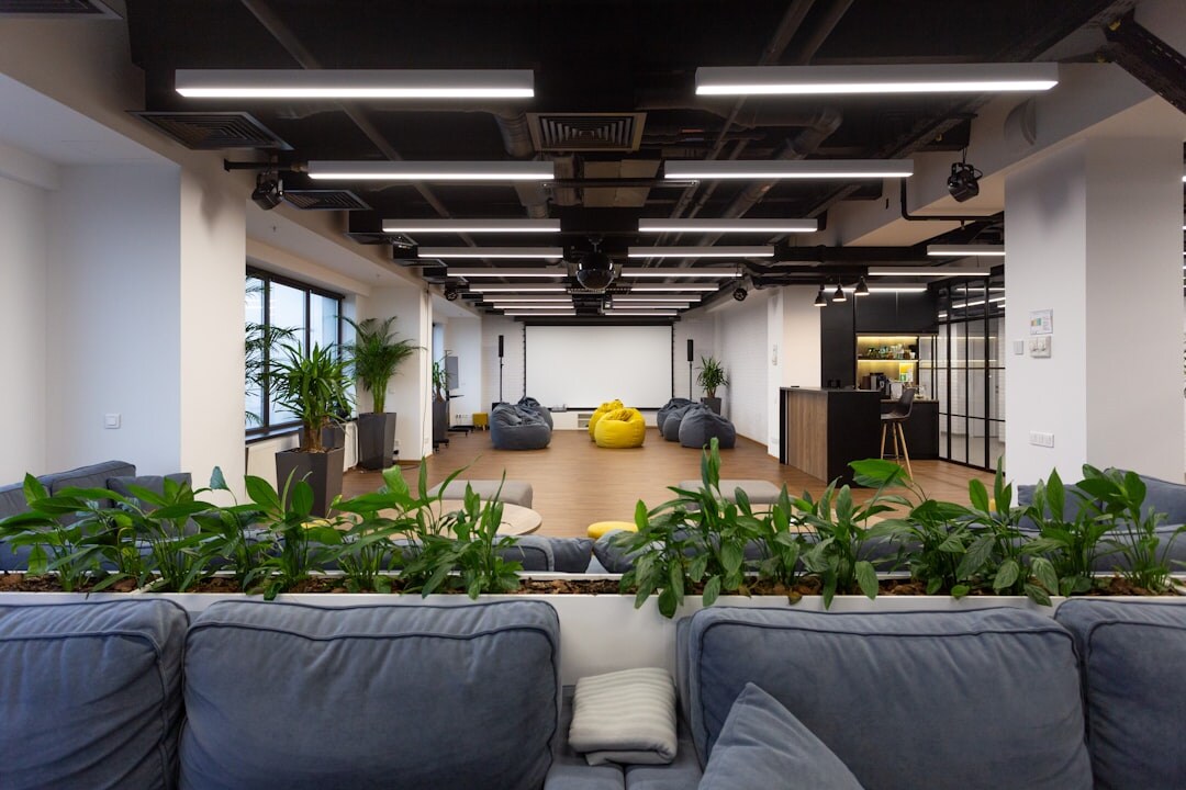 Modern media training office reception with plants and screens