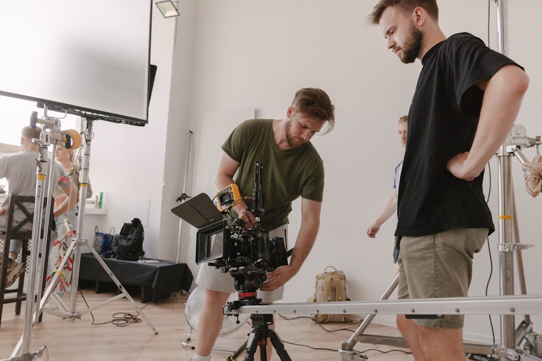 Diverse team of trainers reviewing footage together around a table