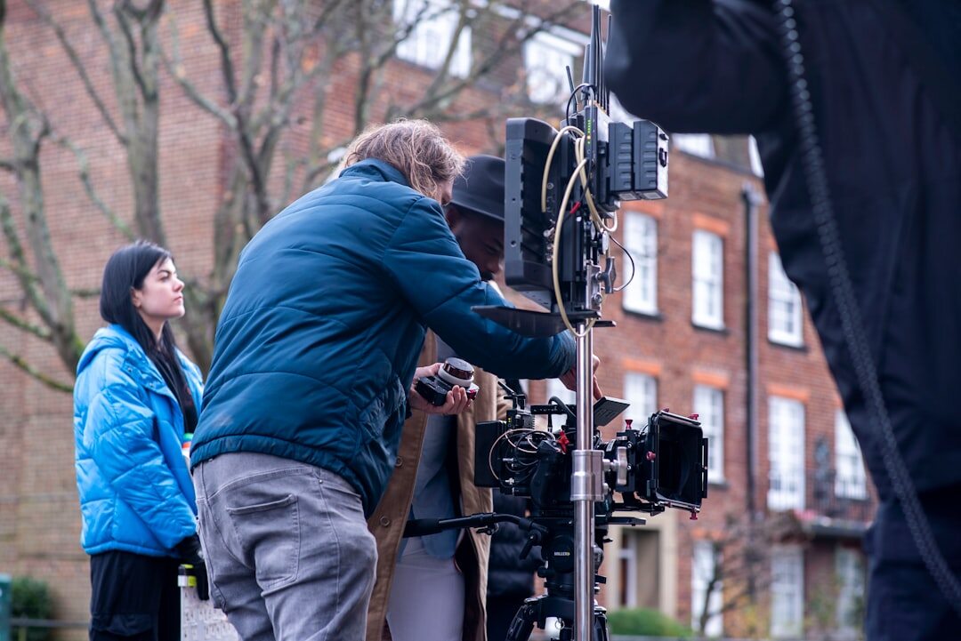 Diverse camera crew filming a reportage outdoors in the city