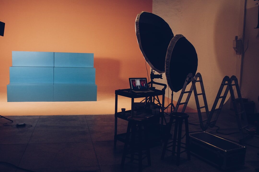 Live streaming studio with cameras, lighting and a presenter desk
